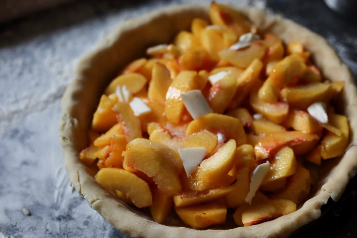 an unbaked peach pie