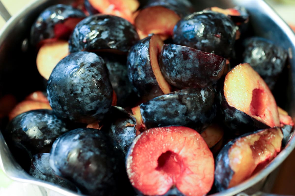 plums in a cooking pot
