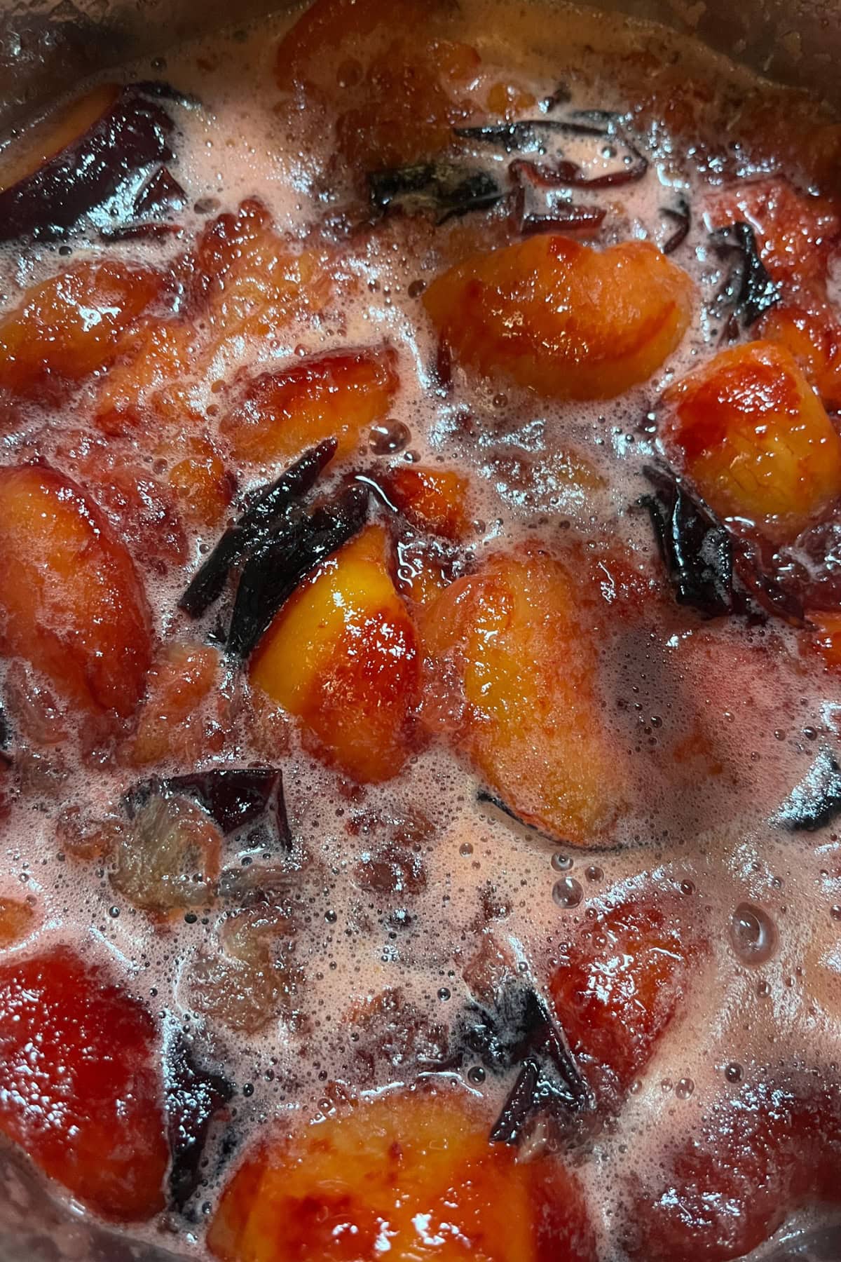 plums cooking in a pot
