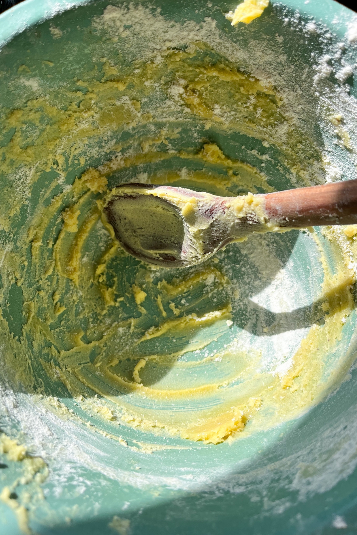 an empty antique bowl with cookie dough scrapings