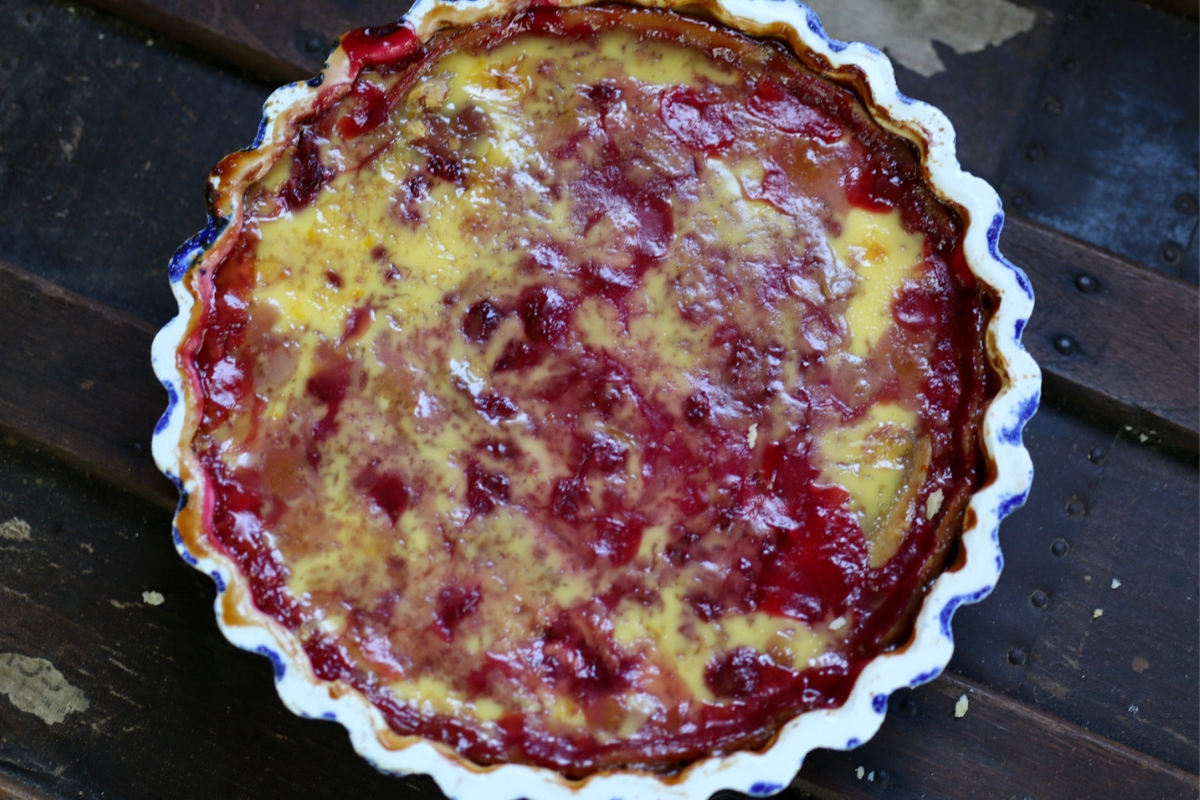 a raspberry tart with cream