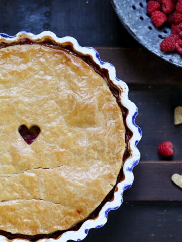 a raspberry tart with cream