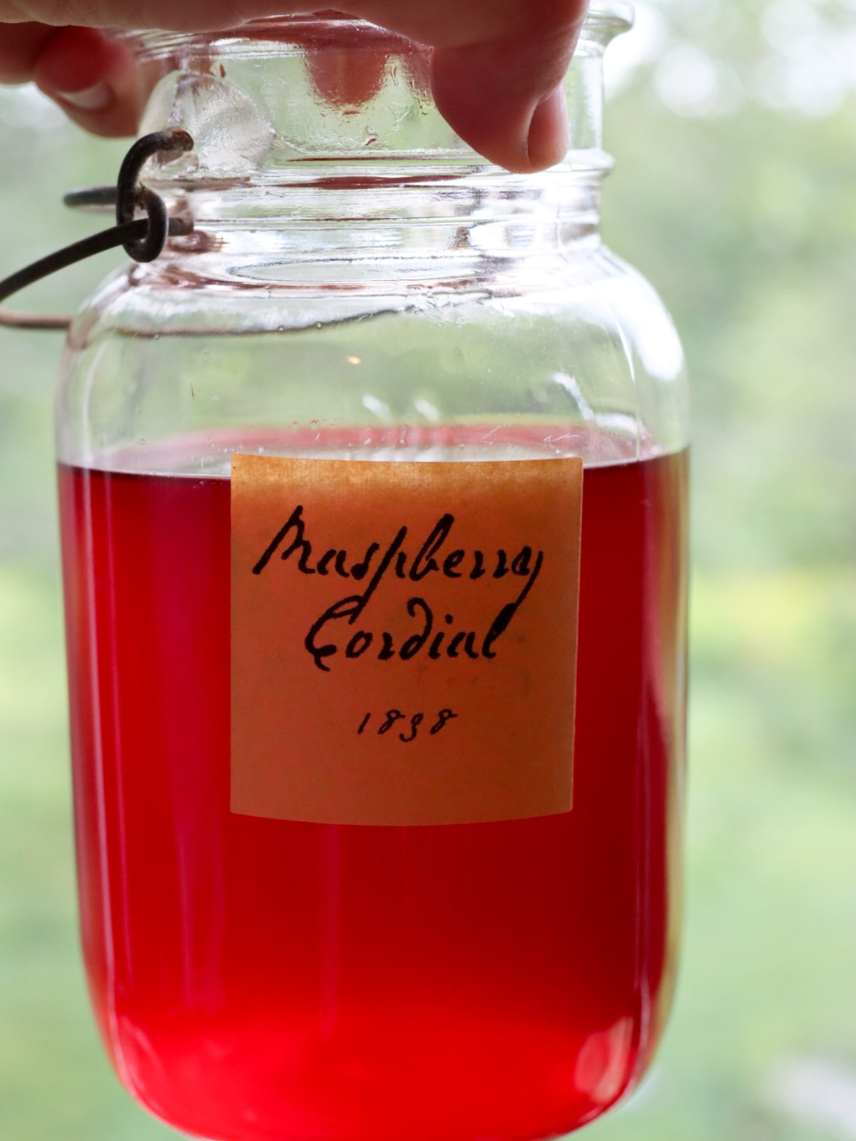 a jar of old fashioned raspberry cordial
